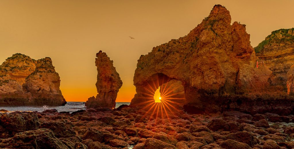 warm sunbeams through a rock formation